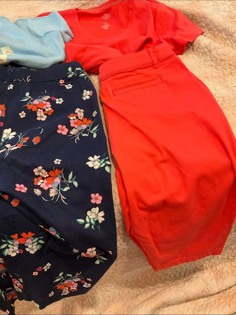 Coral Red V-Neck Top with Floral Navy Pants and Light Blue Tee
